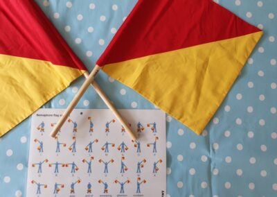 Communications: Four sets of mini semaphore flags and instructions are included in this loan box.